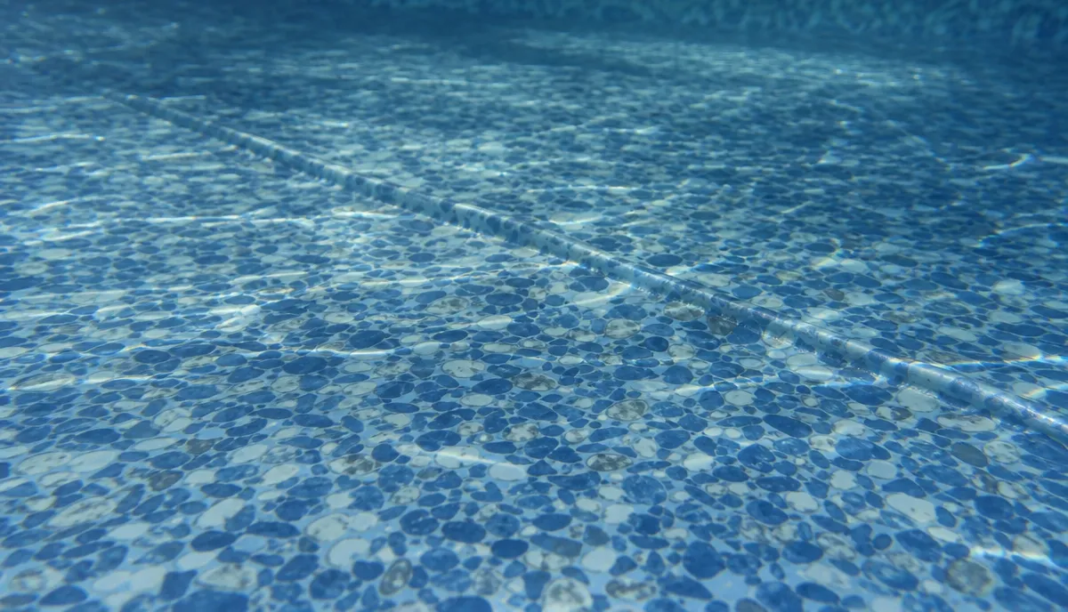 A wrinkle in a vinyl pool liner floor