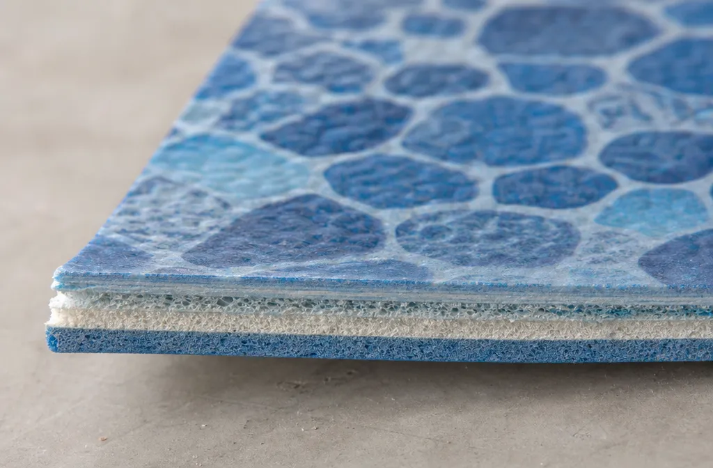 The cut edge of vinyl liner material