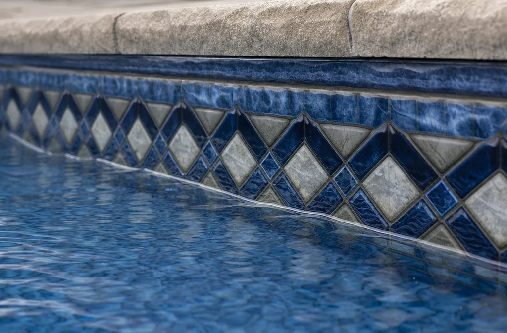 The waterline tile band of a vinyl pool liner
