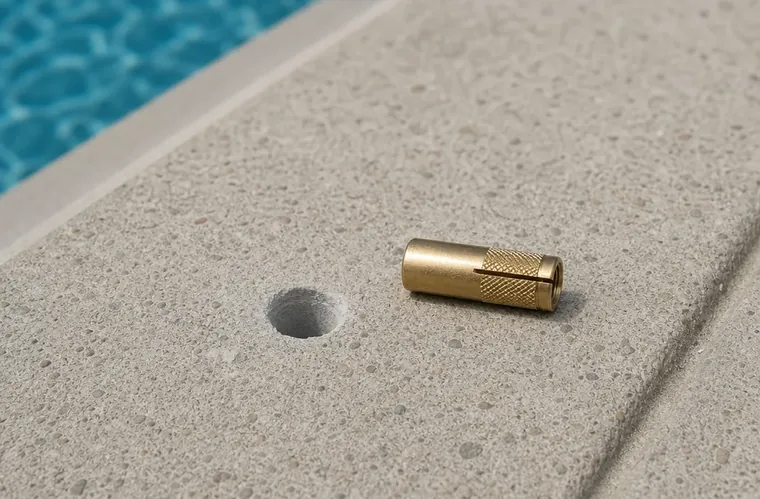A cover anchor being set into a drilled pool deck